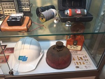 Display case with old highway construction equipment. For more information; call (619) 688-6670 or email CT.Public.Information.D11@dot.ca.gov