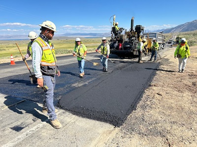 Crews lay down asphalt within the Conway Ranch Shoulders Project in Mono County