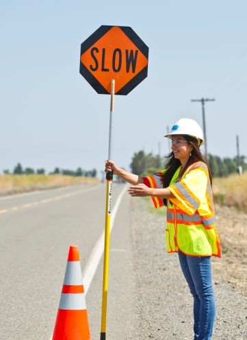 flagging operator letting traffic proceed