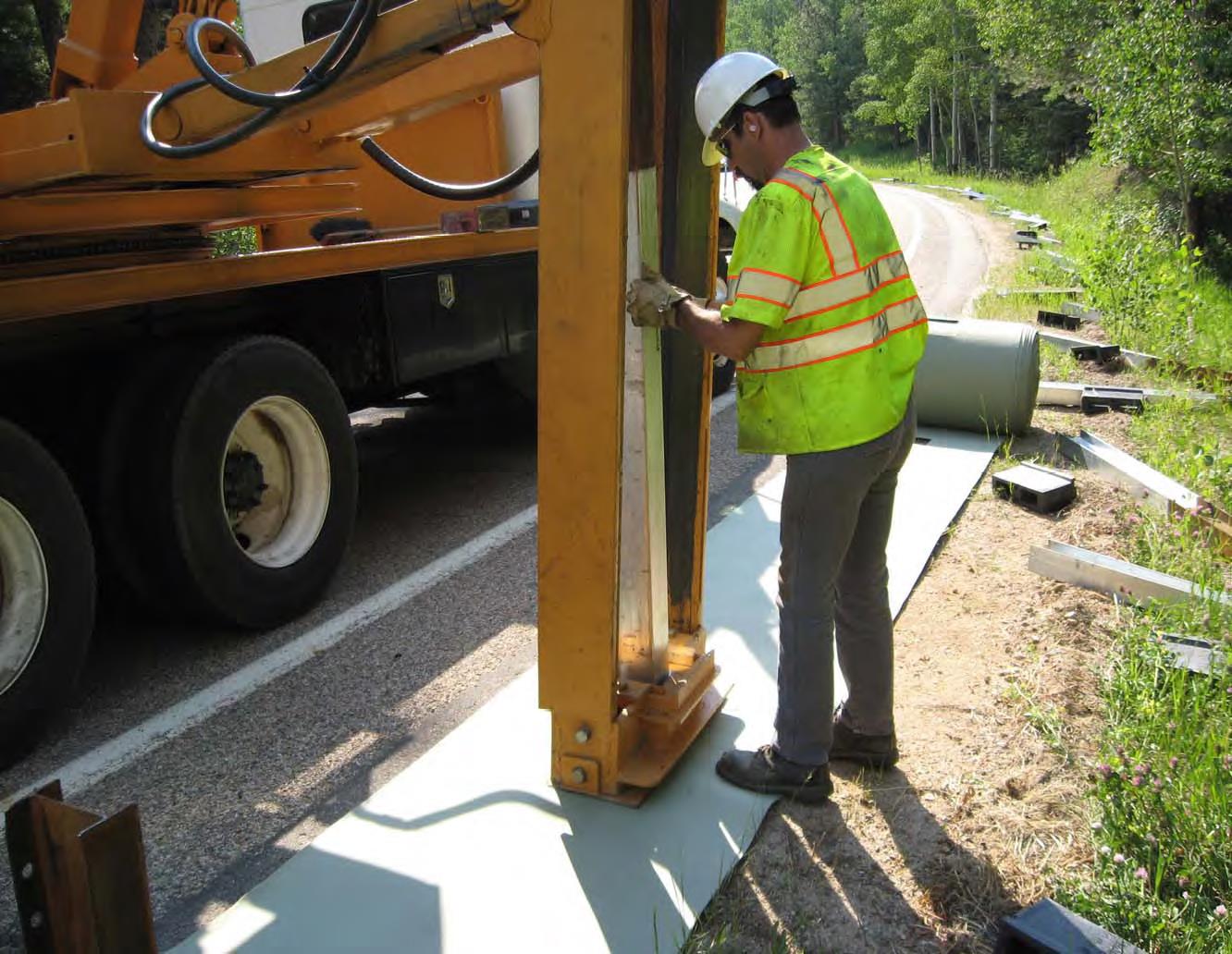 Photo of construction worker applying mat