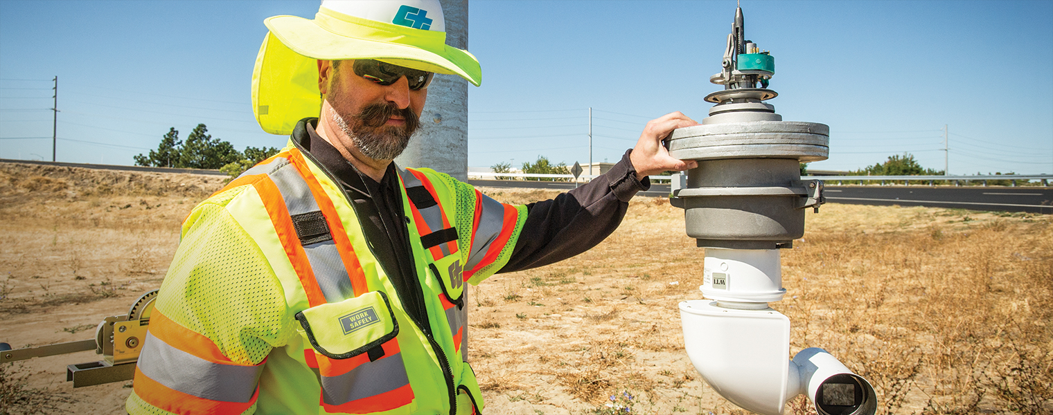 Caltrans engineer David Busler inspects a closed circuit television camera that monitors highway activity. It’s a newly designed model with a retractable assembly that allows crews access to the unit without a boom truck. Caltrans has more than 3,000 cameras watching for incidents and traffic flow.