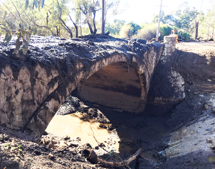 Photo showing the old Romero Creek bridge before construction.