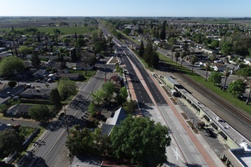 Image of traffic islands and raised median islands that introduce a curb adjacent to vehicles and has the effect of slowing vehicles